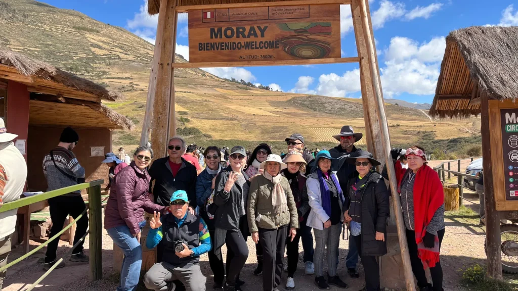 Group of travelers at the entrance to the Moray archaeological site